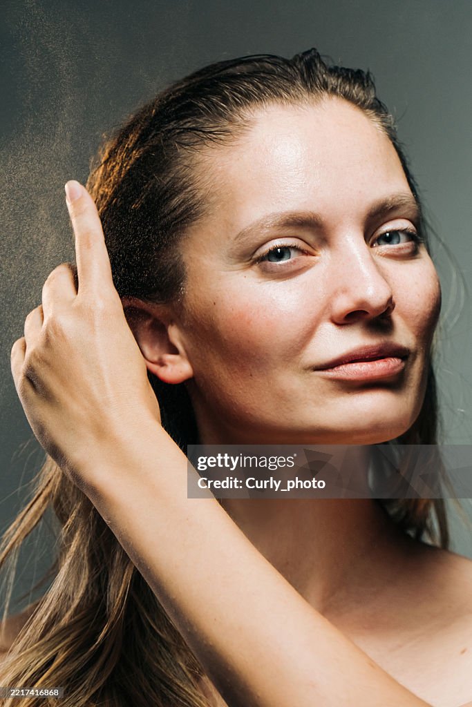 Woman haircare concept. Woman spraying hairspray.