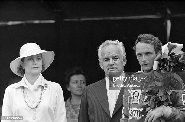 Princess Grace and Prince Rainier III stand on the podium with race winner Niki Lauda after the Monaco GP, Monte Carlo, Monaco, Sunday 30th May 1976.
