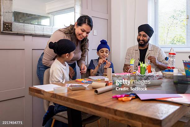 playing arts and crafts - sikhism stock pictures, royalty-free photos & images