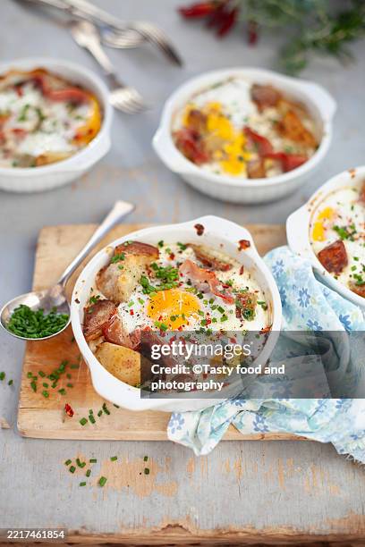 oven-baked egg, ham, potatoes and cheese - egg casserole stock pictures, royalty-free photos & images