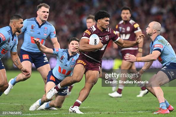 Rob Toia Robert Toia of the Maroons runs the ball during game one of the Men's ...
