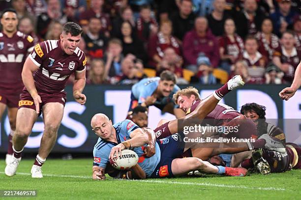 Dylan Edwards of the Blues scores a try during game one of the Men's State of Origin series between Queensland Maroons and New South Wales Blues at...