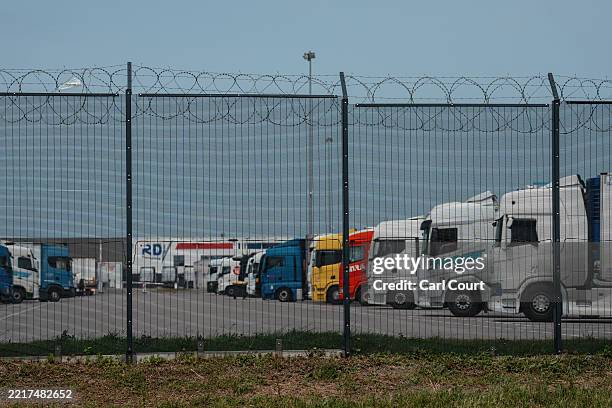 Razor wire fence surrounds a truck park to protect vehicles from stowaway attempts by migrants trying to cross the English Channel, on June 1, 2025...