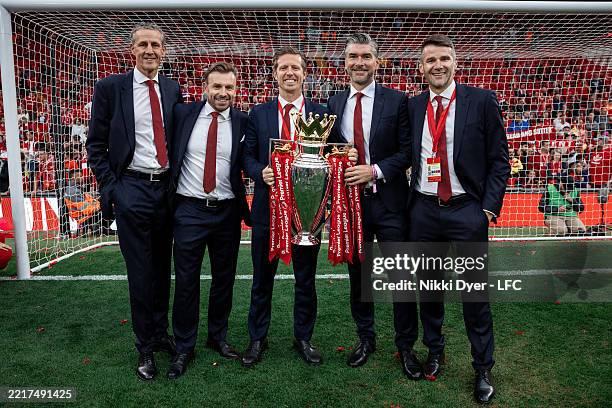 Barry Hunter, Julian Ward, Michael Edwards, Richard Hughes and David Woodfine pose for a photograph with the Premier League trophy, as Liverpool are...