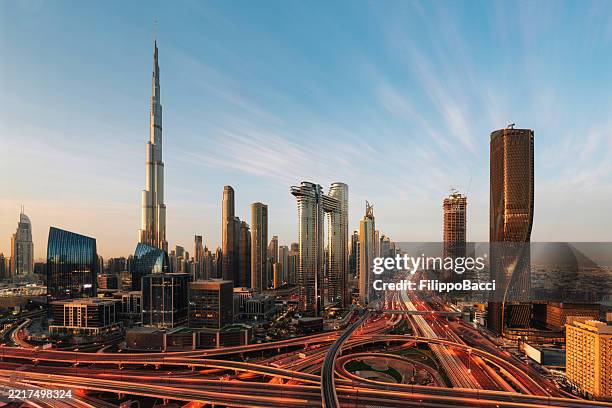 aerial view of dubai skyline at sunset - dubai skyline stock pictures, royalty-free photos & images