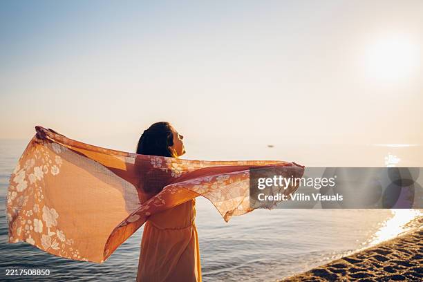 woman enjoy on the sea - shawl stock pictures, royalty-free photos & images
