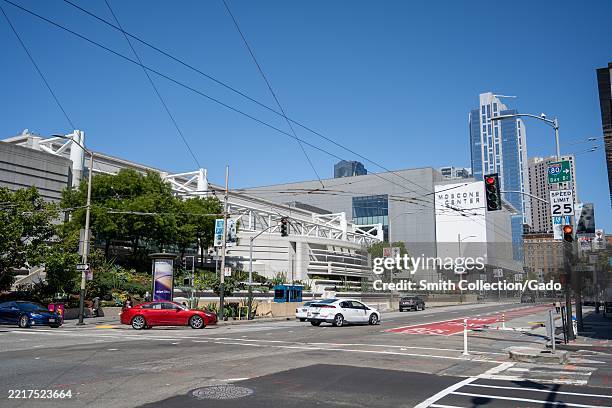 Daytime street view of cars at traffic light in front of Moscone Center along Folsom Street, San Francisco, California, May 27, 2025.