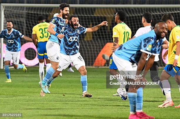 Pyramids' players celebrate after winning the second leg of the CAF Champions League final football match between Pyramids FC and Mamelodi Sundowns...