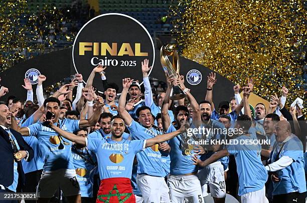 Pyramids' players celebrate winning the CAF Champions League final football match between Pyramids FC and Mamelodi Sundowns at 30 June Stadium in...