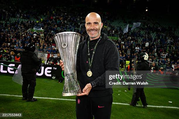 Enzo Maresca, Manager of Chelsea, poses for a photo with the UEFA Conference League trophy after his team's victory in the UEFA Conference League...