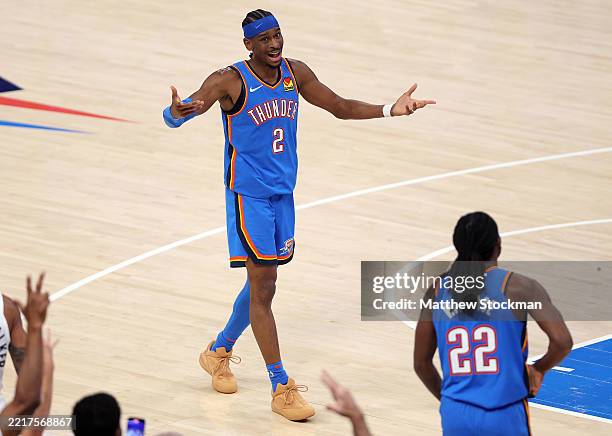 Shai Gilgeous-Alexander of the Oklahoma City Thunder reacts after a three-point basket by Cason Wallace against the Minnesota Timberwolves at the end...