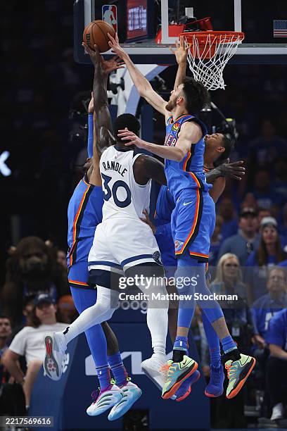 Chet Holmgren of the Oklahoma City Thunder defends against Julius Randle of the Minnesota Timberwolves during the second quarter in Game Five of the...
