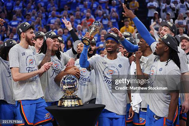 Shai Gilgeous-Alexander of the Oklahoma City Thunder celebrates with teammates after winning the Western Conference Finals MVP after defeating the...