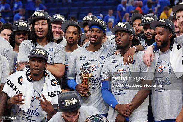 Shai Gilgeous-Alexander of the Oklahoma City Thunder poses with teammates after defeating the Minnesota Timberwolves 124-94 in Game Five of the...