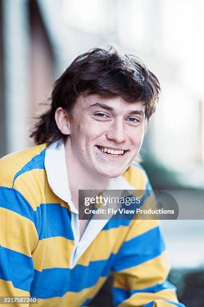 smiling teenage boy with mullet style haircut - mullet haircut stock pictures, royalty-free photos & images
