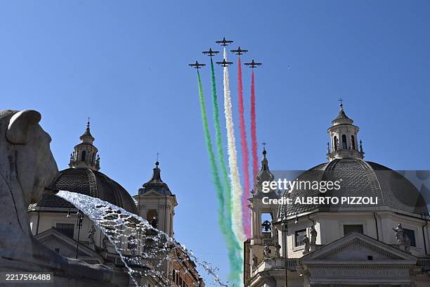 The Italian Air Force acrobatic unit Frecce Tricolori performs over the Basilica di Santa Maria in Montesanto and the church di Santa Maria dei...