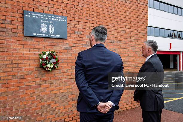 In this handout image provided by Liverpool FC, LFC’s chief legal and external affairs officer, Jonathan Bamber, and former player John Aldridge laid...