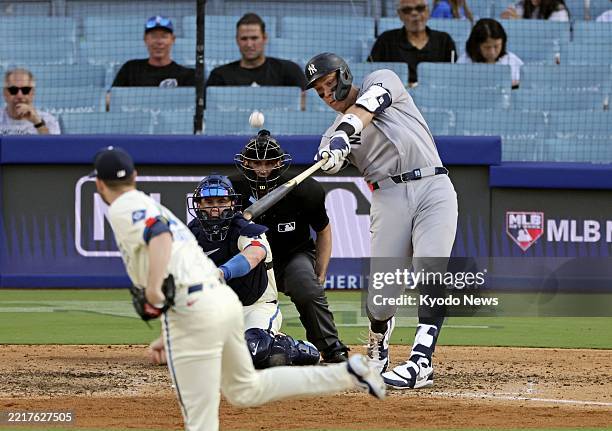 Aaron Judge of the New York Yankees hits a solo home run in the eighth inning of a baseball game against the Los Angeles Dodgers at Dodger Stadium in...