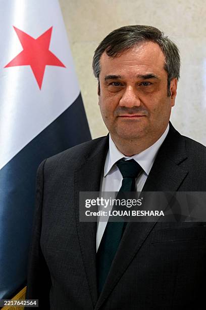 Abdul Qader al-Husri, Governor of the Central Bank of Syria, poses for a picture ahead of the opening of the stock market in the Ya'fur area near...