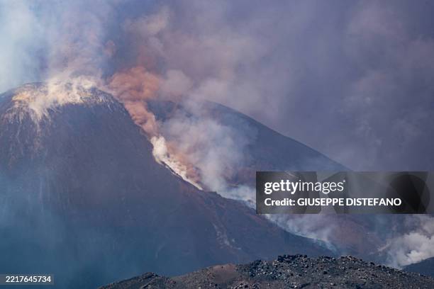 Smoke rises from the crater of the Etna volcano as it erupts, on Mount Etna near Catania on June 2, 2025. A huge plume of ash, gas and rock spewed...