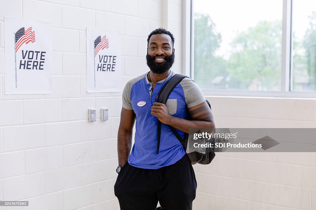 African-American Man Smiling After Voting at Polling Place
