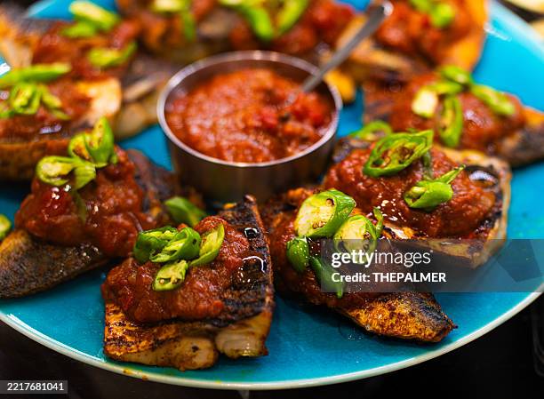 grilled fish with tomato salsa and peppers - chili sauce stock pictures, royalty-free photos & images