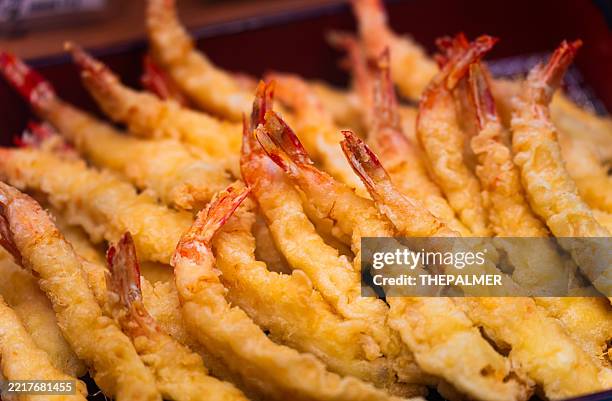 shrimp tempura piled in tray - tempura stock pictures, royalty-free photos & images