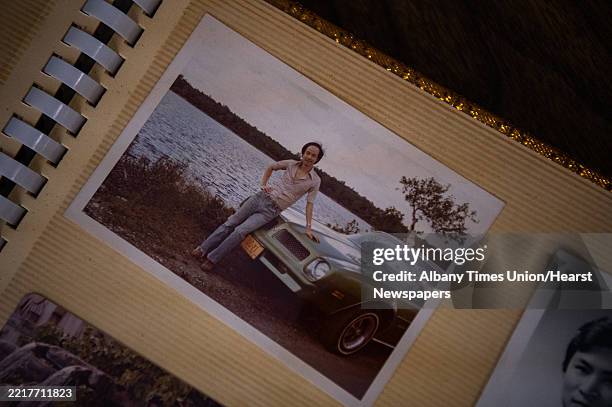 Tom Sit, owner of Eng's Chinese Chinese Restaurant, shows an old photo of him and the first car that he purchased, a Pontiac Firebird, at Eng's...