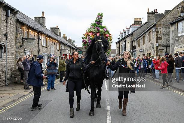 The Garland King is led through the village during the annual Garland Day parade on May 29, 2025 in Castleton, England. The first records of Garland...