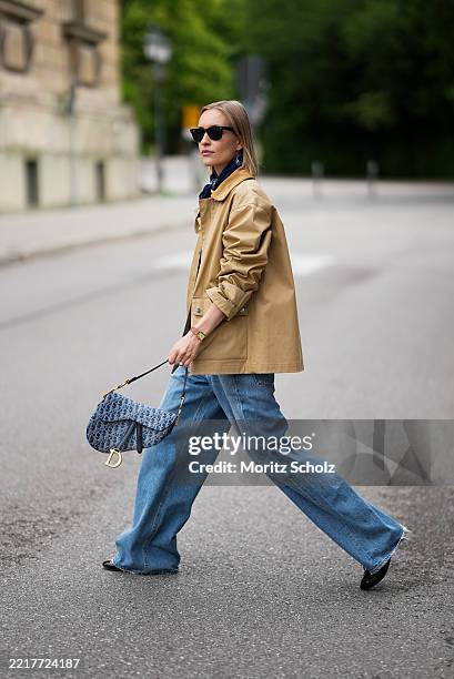 Marlies Pia Pfeifhofer is seen wearing an oak beige Spring Decker utility jacket with corduroy collar and multiple pockets from GANT, a mid blue wide...