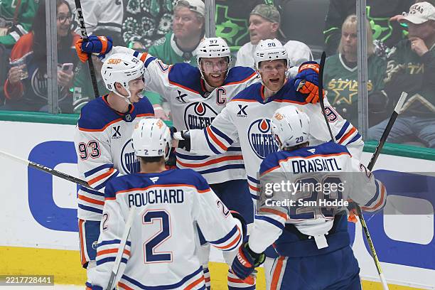 Corey Perry of the Edmonton Oilers celebrates with Connor McDavid, Ryan Nugent-Hopkins, Evan Bouchard and Leon Draisaitl after scoring a goal against...