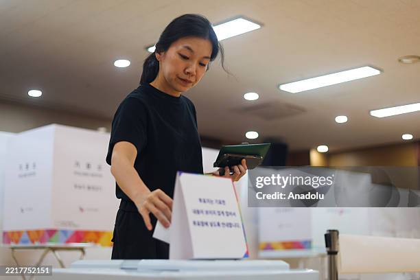 People cast their ballots at a polling station on the voting day for the South Korean presidential election, in Seoul, South Korea, on June 03, 2025....