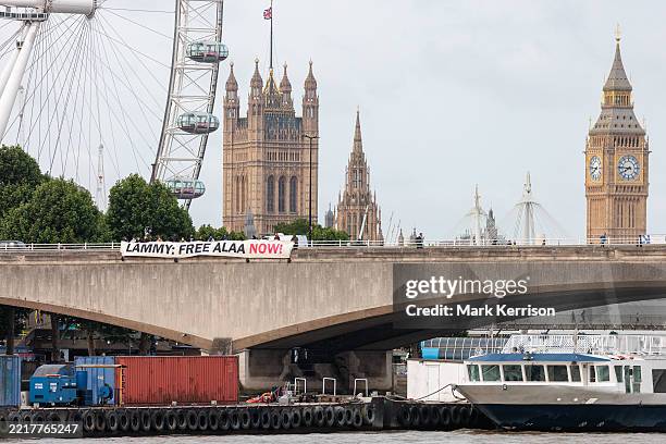 Supporters of the Free Alaa campaign drop a banner reading 'Lammy Free Alaa Now' from Waterloo Bridge on 3rd June 2025 in London, United Kingdom....