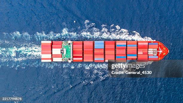 aerial top view container ship full speed on the blue sea delivery container for logistics. - shipping container top view - fotografias e filmes do acervo