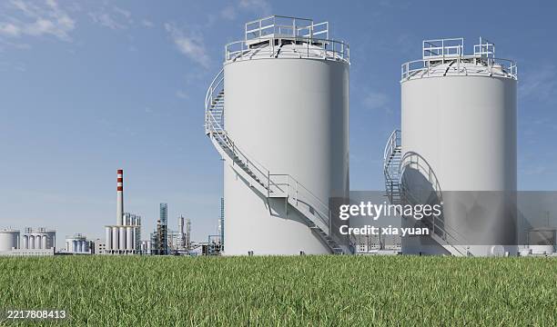 chemical storage in a grassy field - tanque de combustível parte de veículo - fotografias e filmes do acervo