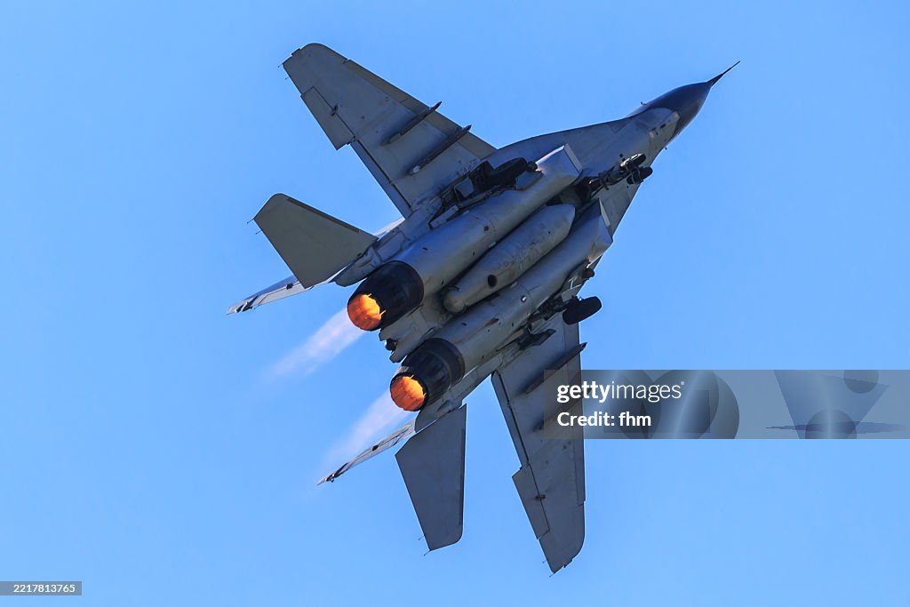 Fighter aircraft with afterburner in the sky (MIG 29)