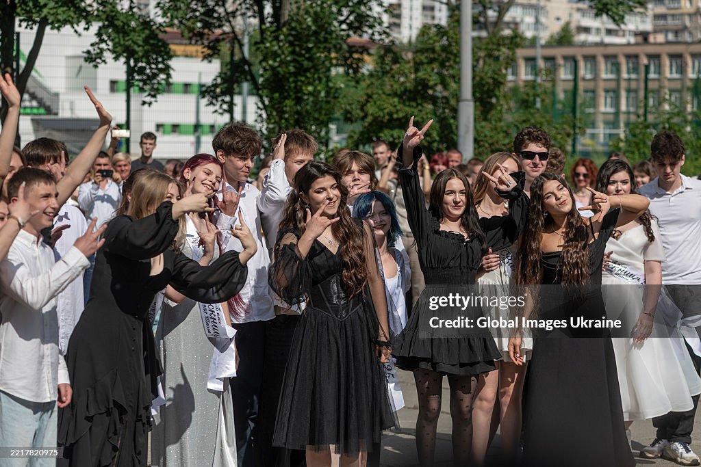 Last Bell School graduates pose for a joint photo during the last bell ceremony ...