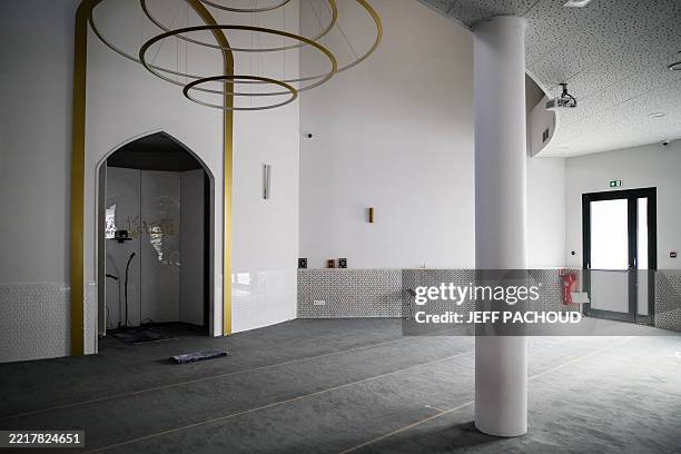 This photograph shows the prayer room of the Errahma mosque in Villeurbanne, central France, on June 3, 2025. A Koran was stolen and burnt at a...