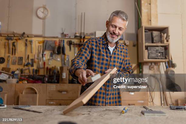 skilled craftsman working in woodworking shop - carpentry stock pictures, royalty-free photos & images