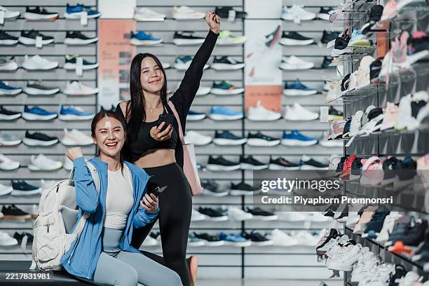 happy asian women payment by smartphone in sport shop. shopping success, athletic fashion, fitness gear, retail experience, activewear shopping, consumer lifestyle. - buy online pick up in store stock pictures, royalty-free photos & images