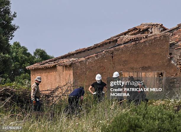 German investigators work during a new search operations amid the investigation into the disappearance of Madeleine McCann at Atalaia, Lagos in...