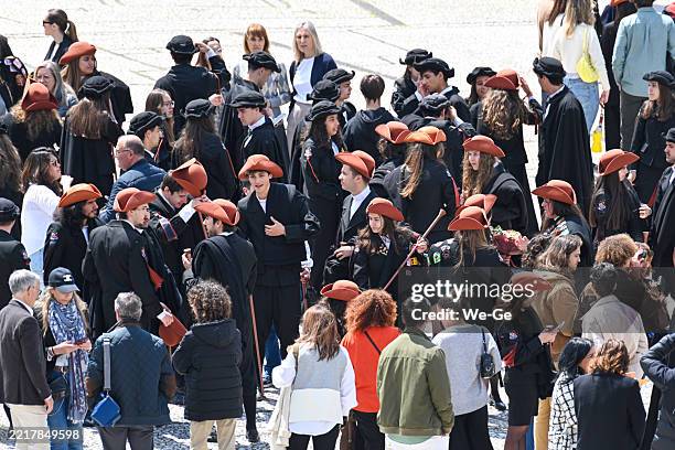 traditionally dressed students celebrate the student festival queima das fitas at the toural square in the historic old town of guimarães, district of braga, portugal. - knickerbocker glory stock pictures, royalty-free photos & images