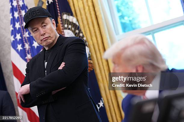 Tesla CEO Elon Musk listens as U.S. President Donald Trump speaks to reporters in the Oval Office of the White House on May 30, 2025 in Washington,...