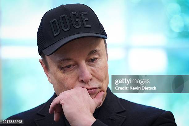 Tesla CEO Elon Musk listens as U.S. President Donald Trump speaks to reporters in the Oval Office of the White House on May 30, 2025 in Washington,...