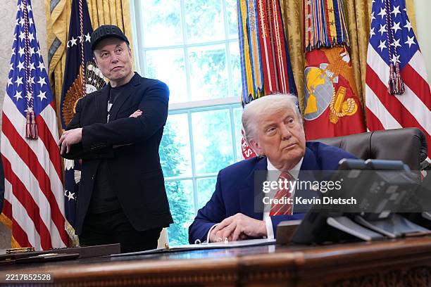 Tesla CEO Elon Musk and U.S. President Donald Trump listen to a question from reporters in the Oval Office of the White House on May 30, 2025 in...