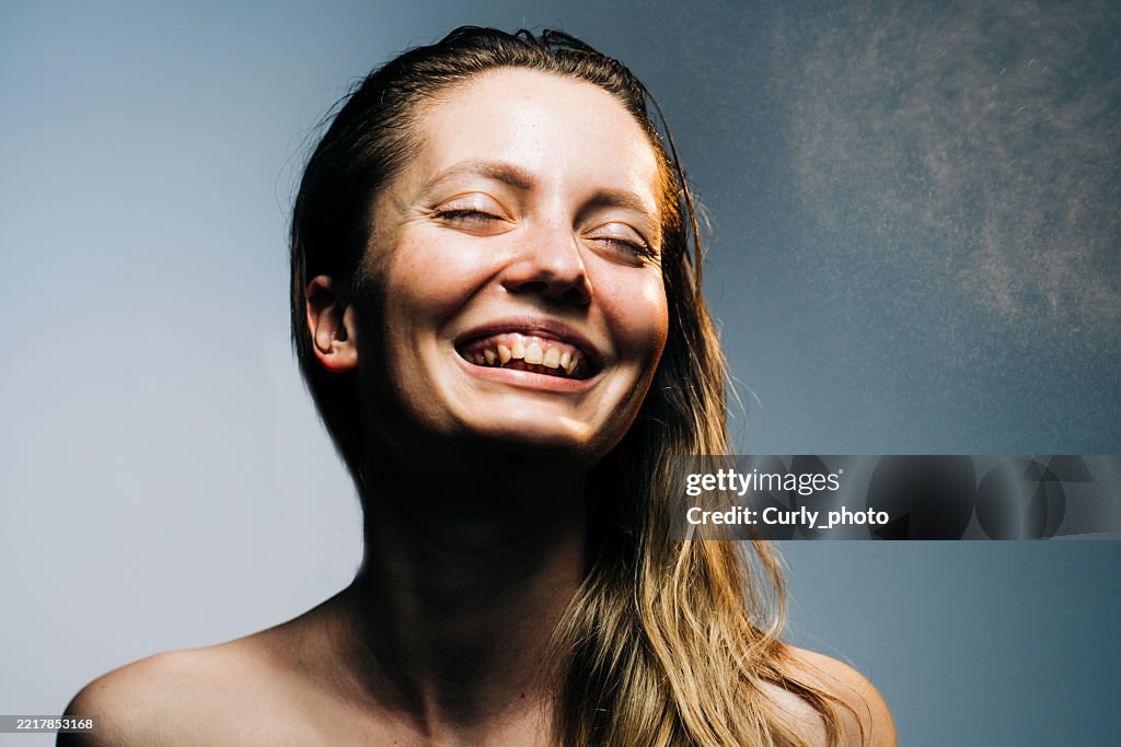 Woman haircare concept. Woman spraying hairspray.