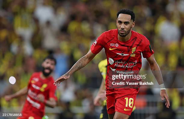 Pierre-Emerick Aubameyang of Al-Qadisiyah celebrates scoring his team's first goal from the penalty spot during the Final King's Cup match between Al...