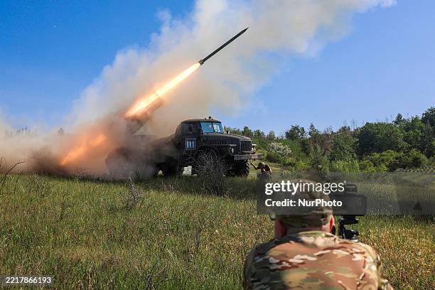 Soldiers of the 30th Prince Konstanty Ostrogski Mechanized Brigade fire a missile from a BM-21 Grad multiple rocket launcher at the positions of...