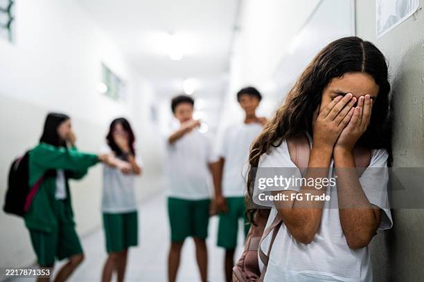 child girl sad to be being bullied at school - mobbning bildbanksfoton och bilder