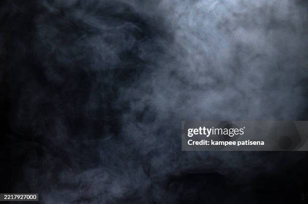 white smoke against black background - fumo imagens e fotografias de stock